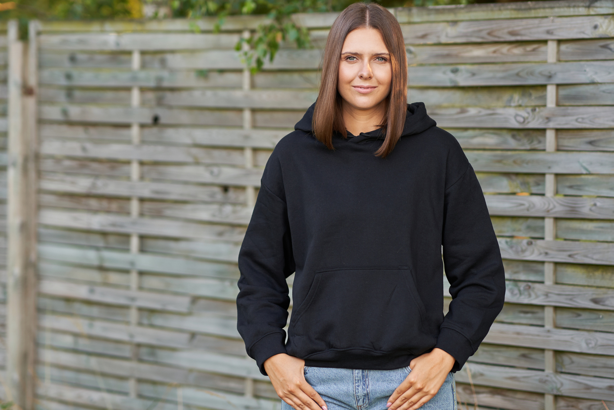 Young Woman in Black Hoodie.